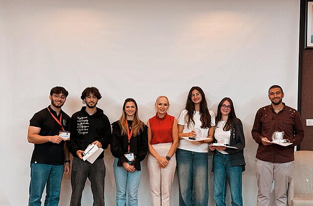 Ala' Al-Turki, President of the German Club, and Jacqueline Rogler, Director of the German Language Center, with the winners of the treasure hunt - the first event launched by the club.